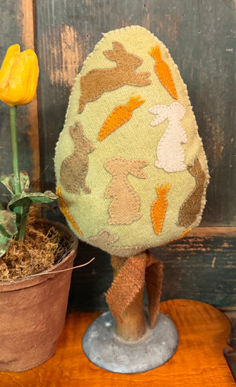 PB-658 Wool Egg with Appliques on Old Farm Tool
