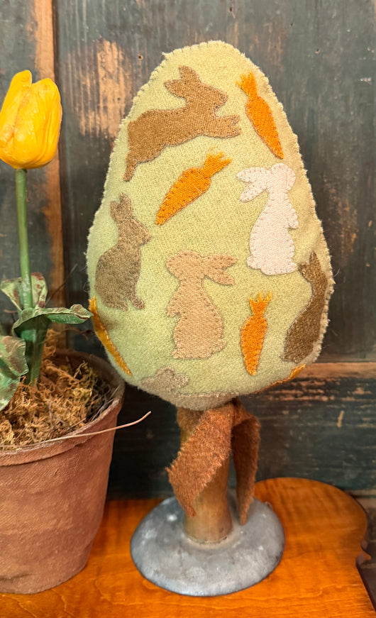 PB-658 Wool Egg with Appliques on Old Farm Tool